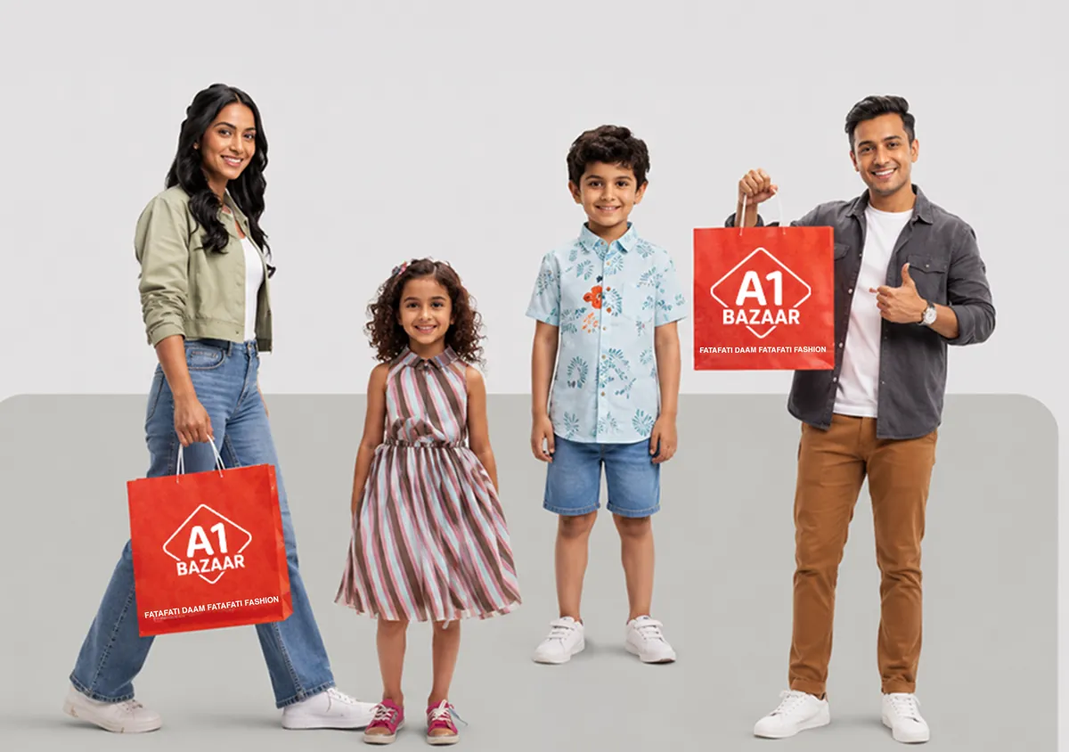 A family of four carrying red A1 Bazaar shopping bags